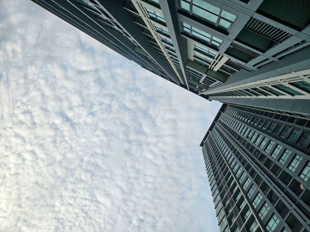 Low angle view of sky and cloud with modern office building or apartment