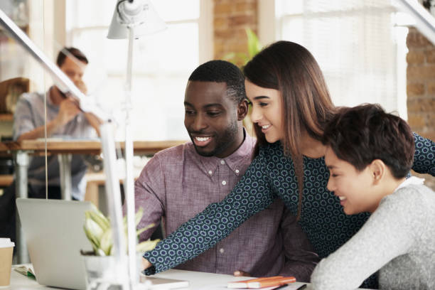 istock Collaboration, team work or people in a meeting planning ideas for a startup or project development. Innovation, leadership or creative woman working on research, data or strategy with designers 2156449405