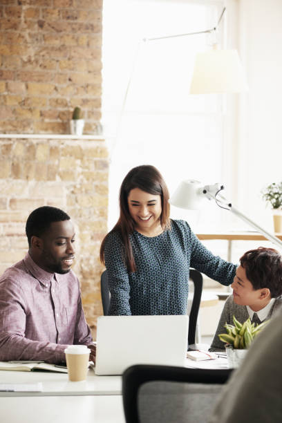 istock Innovation, collaboration or creative people in a meeting planning ideas for our vision or startup development. Manager, leadership or woman speaking of research or strategy with graphic designers 2156449407