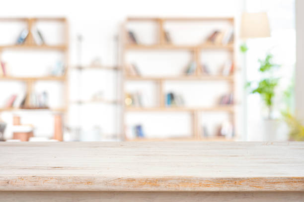 istock Light wooden table top with copy space in blurred study room 2156450889