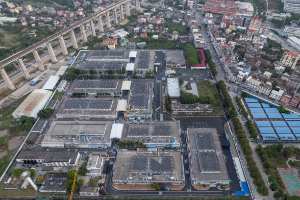 istock Solar panels installed in factory buildings 2156451974