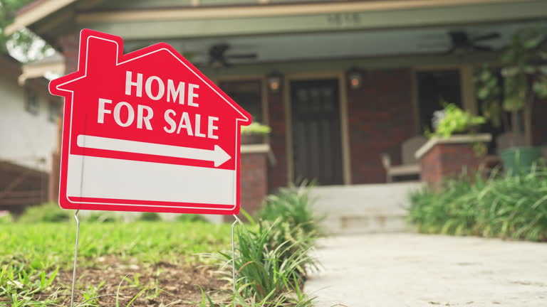 Close-up video of a home for sale sign