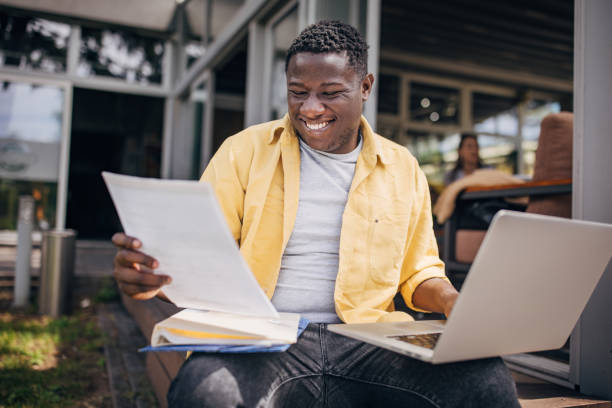 istock Businessman working remotely outdoors on the laptop 2156454825