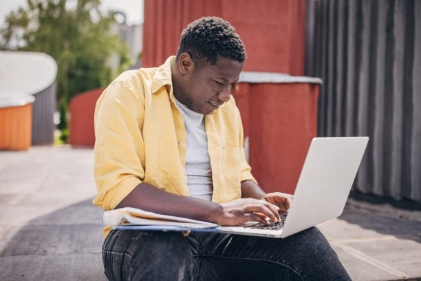 istock Businessman working remotely outdoors on the laptop 2156454836