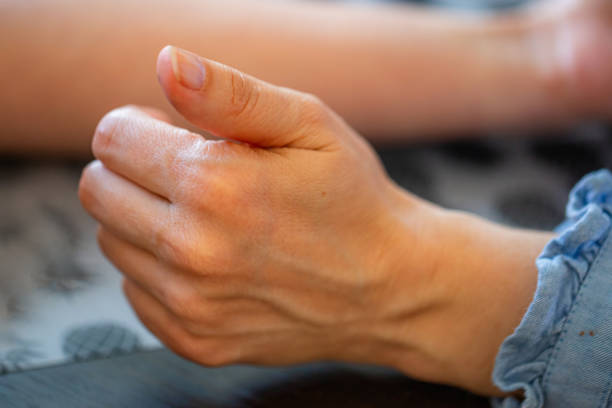 istock Close Up of a Persons Hand Resting on a Table 2156455106