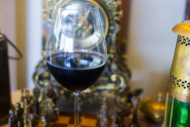 istock Red wine glass among vintage items 2156457198