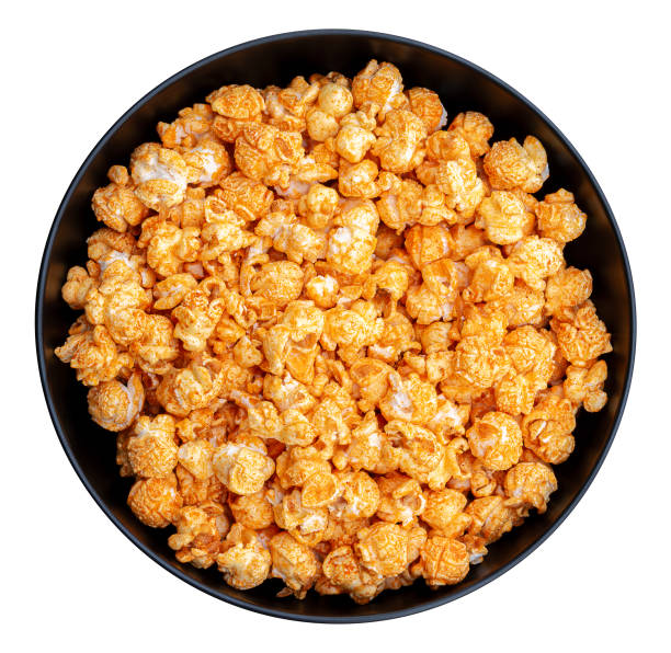 Top view popcorn cheese flavor in a black bowl isolated on white background with clipping path