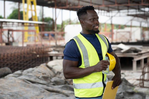 istock Portrait African engineer man use clipboard checking precast cement at precast cement outdoor factory 2156460947
