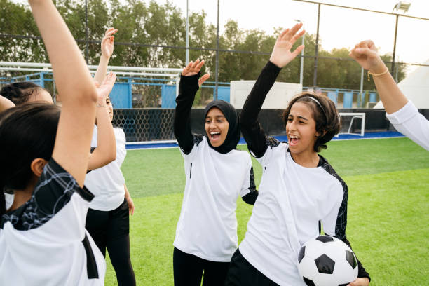 istock Excited female athletes with hands raised 2156461537