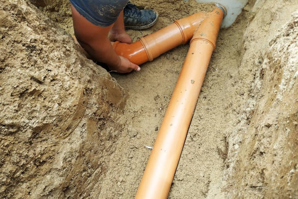 istock A locksmith supplies a sewer pipe to the sump. 2156463798
