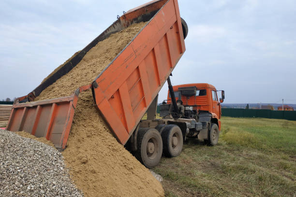 istock A dump truck unloads sand at a construction site. 2156464958