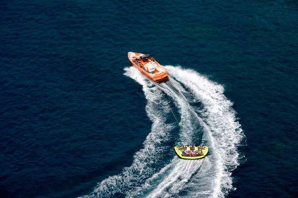 Boy being towed on Inflatable tube