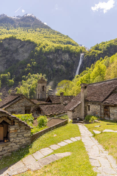 istock Charming Village with Waterfall in the Mountains 2156465543