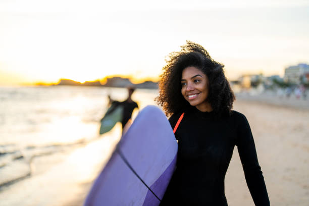 istock Elegant Surfer with Board on Beach at Sunset 2156467791