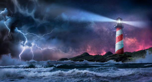 Lighthouse In Storm At Night Lighthouse In Storm - Leader And Vision Concept - Landscape With Milky Way Against Dramatic Sky lighthouse stock pictures, royalty-free photos & images