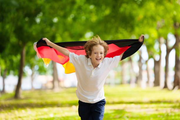 istock Child running with Germany flag. 2156471206