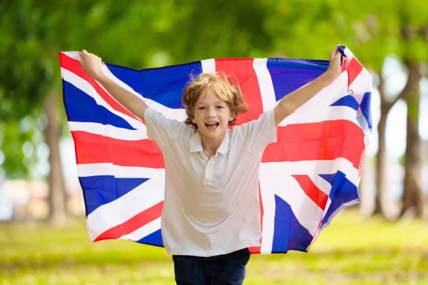 istock Child running with UK flag. Britain supporter 2156472298