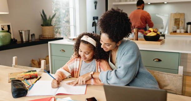 istock Child, laptop and question for knowledge, learning and growth for future or education. Woman, student and kitchen for help, studying and support or home school for development or writing assessment 2156473493