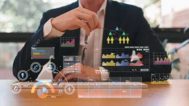 istock Businessman or an analyst uses a computer and dashboard for data business analysis and Data Management System with KPI and metrics connected to the database for technology 2156473932