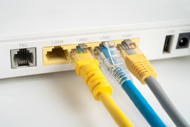 istock Ethernet cable with wireless router connect to internet service provider internet network. 2156474293