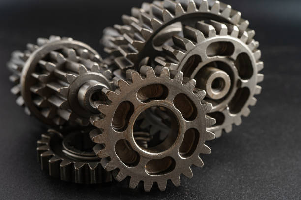 istock Gear and cogs wheels, clock mechanism, brass metal engine industrial. 2156474389