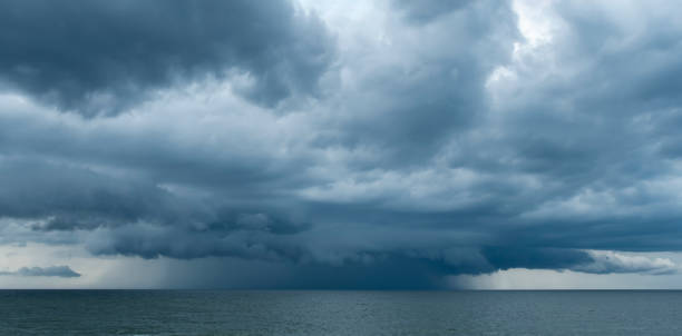 istock Storm over the sea, rain from the clouds 2156474759