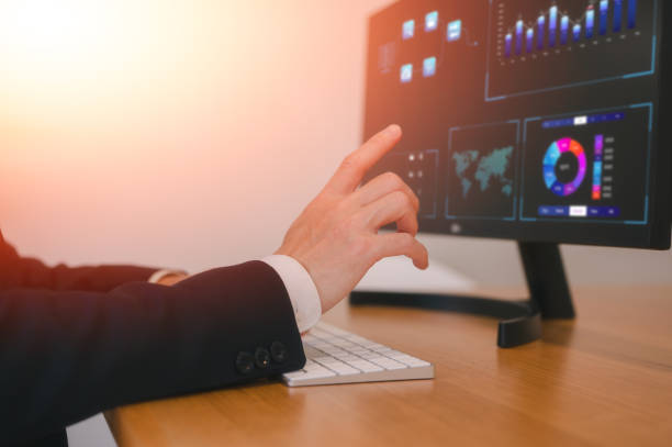 istock Businessman or an analyst uses a computer and dashboard for data business analysis and Data Management System with KPI and metrics connected to the database for technology 2156474781