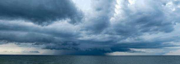 istock Storm over the sea, rain from the clouds 2156474836