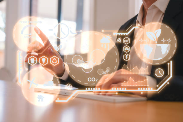 istock Reduce CO2 emissions and carbon footprint to limit global warming and climate change. Sustainable development and green business, man pointing at report and virtual diagram showing co2 emission icon 2156475438