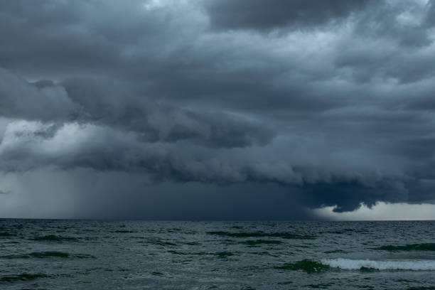 istock Storm over the sea, rain from the clouds 2156475609