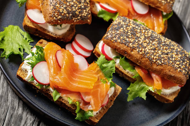 istock smoked salmon sandwiches on rye bread rolls 2156478068