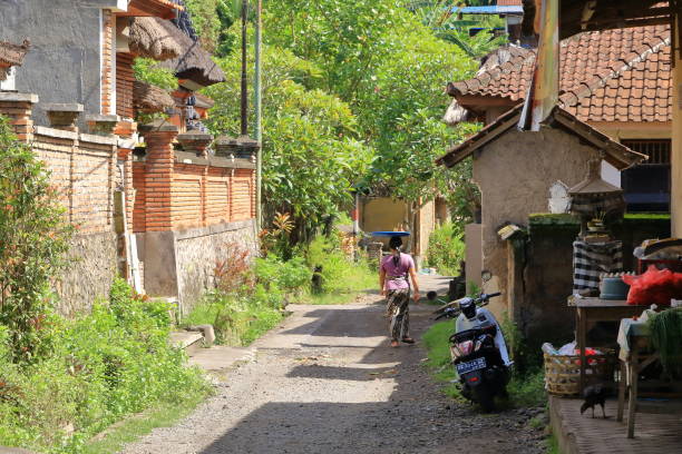 Tenganan, Bali in Indonesia - February 08 2024: lonely streets with only some people in the morning at the village