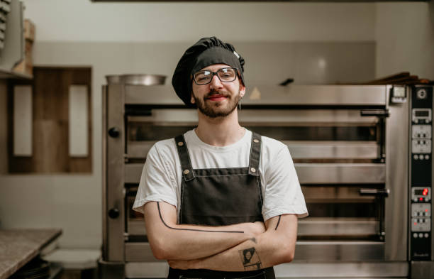 istock portrait of young handsome pizza baker chef 2156483099