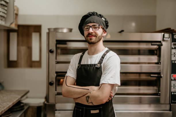 istock portrait of young handsome pizza baker chef 2156483112