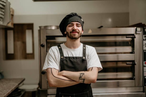 istock portrait of young handsome pizza baker chef 2156483131