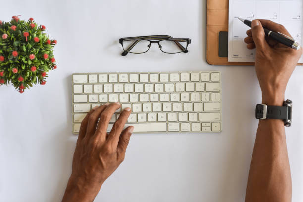 istock Asian man hand typing keyboard flat lay view 2156483179
