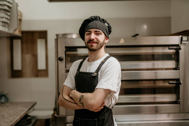 istock portrait of young handsome pizza baker chef 2156483225