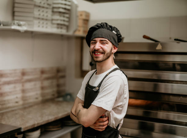 istock portrait of young handsome pizza baker chef 2156483251