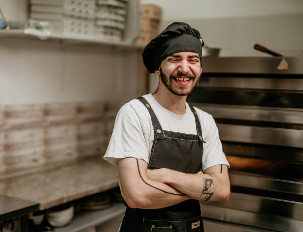 istock portrait of young handsome pizza baker chef 2156483253