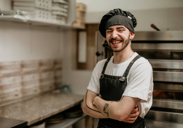istock portrait of young handsome pizza baker chef 2156483302