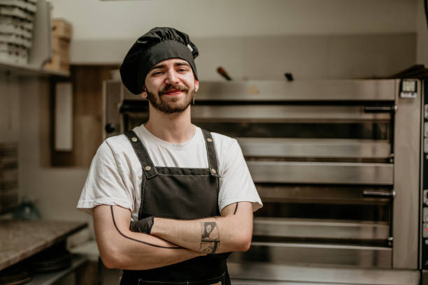 istock portrait of young handsome pizza baker chef 2156483304