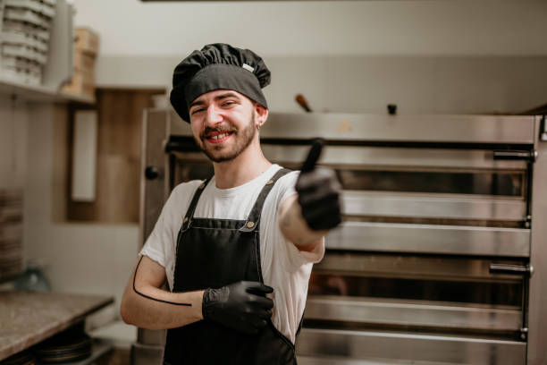 istock portrait of young handsome pizza baker chef 2156483369