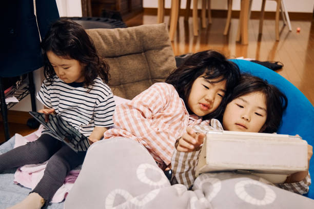 istock Children using smart phones and tablets in the morning 2156483479