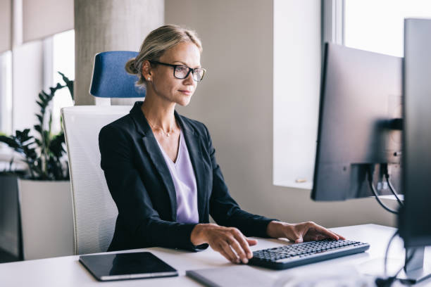 istock Businesswoman working at the office with a computer 2156487801