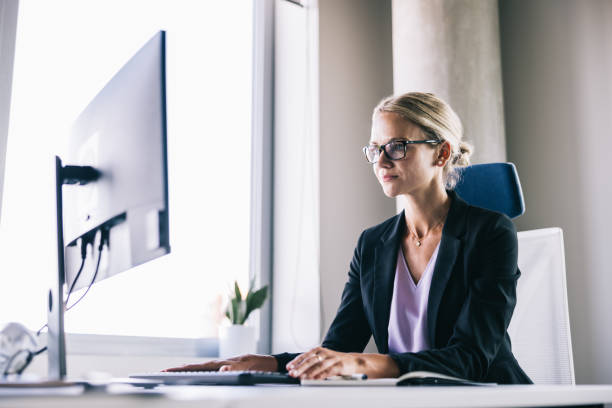 istock Businesswoman working at the office with a computer 2156487804
