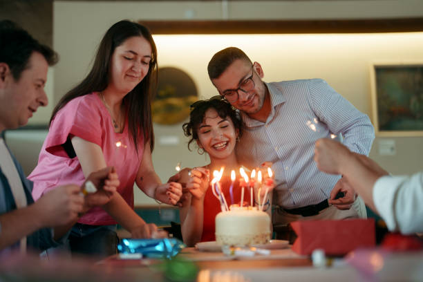 istock People are celebrating birthday at the restaurant 2156488854