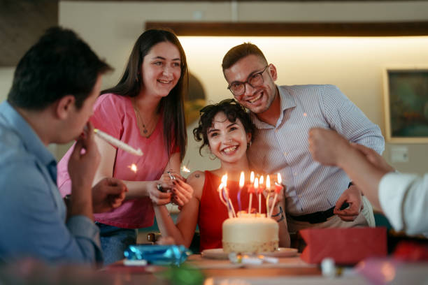 istock People are celebrating birthday at the restaurant 2156489177