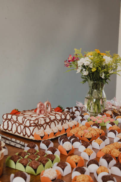 istock 80th birthday cake table arrangement 2156492671