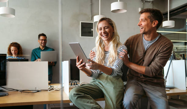 istock Smiling diverse colleagues gather in boardroom brainstorm discuss financial statistics together 2156492681