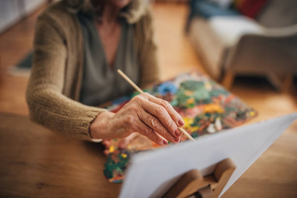istock Woman painting on canvas 2156493490